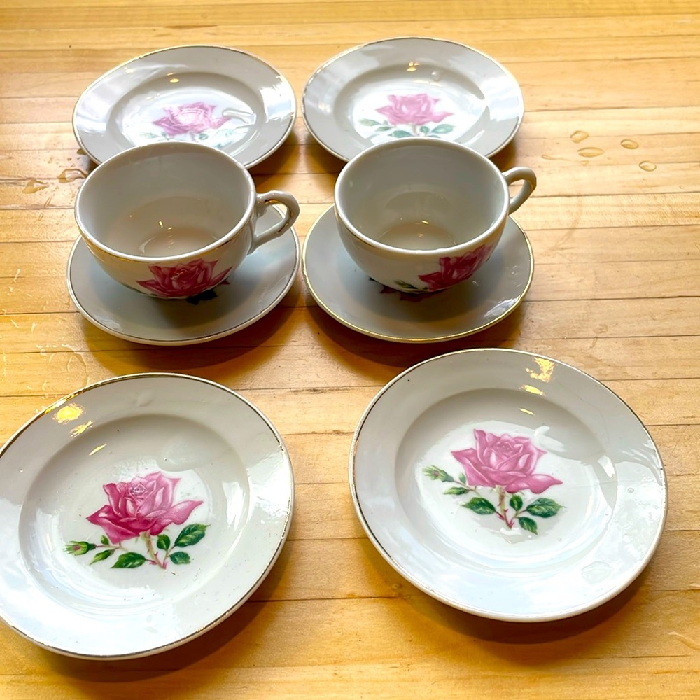 Vintage Childs tea cups, saucers, plates, and pitcher